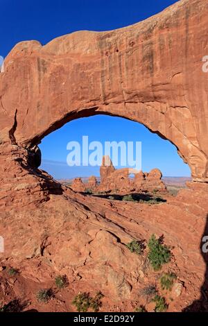 United States Utah Colorado Plateau Arches National Park Turret Arch through North Window Arch at sunrise Stock Photo