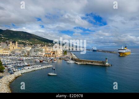 France, Haute Corse, Bastia, the harbour overlooked by St Jean Baptiste Church and the ferry port in the background Stock Photo