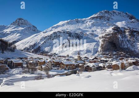 France Savoie Val D'Isere view of the village and Saint Bernard de Menthon Church with a squared Lombard bell tower at dusk and Stock Photo