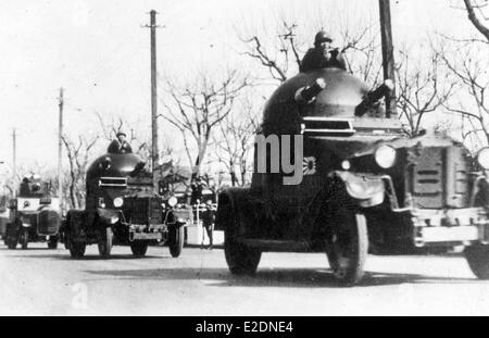 Japanese soldiers pared in armored cars during WW11 Stock Photo