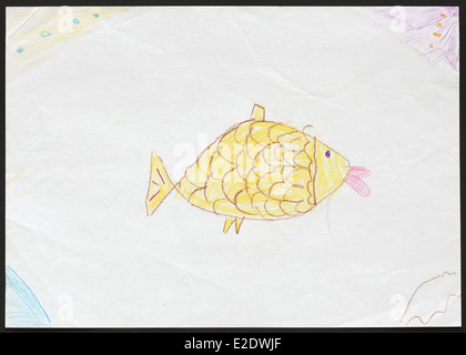 Original child's drawing of a yellow fish drawn by a five-year-old girl. Stock Photo