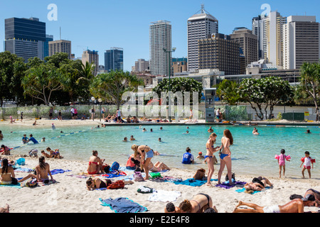 Brisbane Australia,Southbank Parklands,Streets Beach,sunbathers,sand,water CBD,city skyline,skyscrapers,buildings,AU140315046 Stock Photo