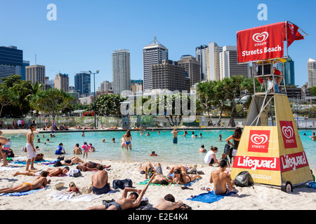 Brisbane Australia,Southbank Parklands,Streets Beach,sunbathers,sand,water CBD,city skyline,skyscrapers,buildings,AU140315048 Stock Photo