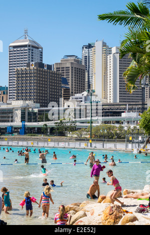 Brisbane Australia,Southbank Parklands,Streets Beach,sunbathers,sand,water CBD,city skyline,skyscrapers,buildings,AU140315052 Stock Photo