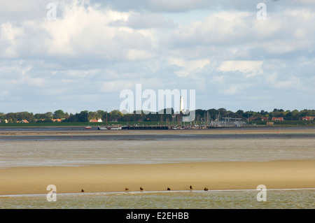 Low tide in the Wadden Sea with a view of two lighthouses on the Island of Schiermonnikoog, Frisia, The Netherlands Stock Photo