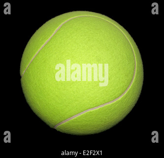 a yellow tennis ball in black back Stock Photo