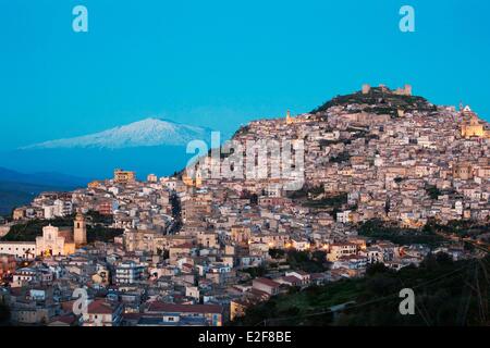 Italy, Sicily, Enna Province, Agira with the Mount Etna listed as World Heritage by UNESCO on the background Stock Photo