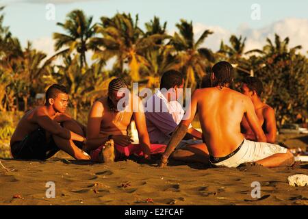 France, Reunion island (French overseas department), Etang Sale, Etang Sale les Bains, young Creoles on the beach at sunset Stock Photo