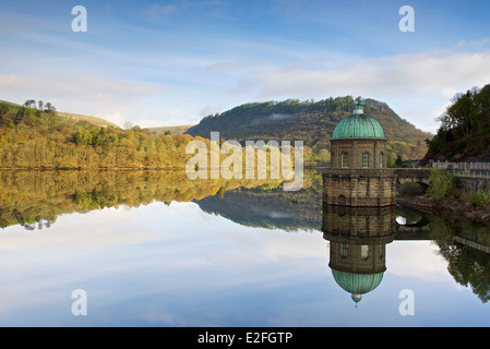 A man made landscape in Wales. A man made reservoir in the Elan valley with the rising mist and straining tower of caban coch Stock Photo