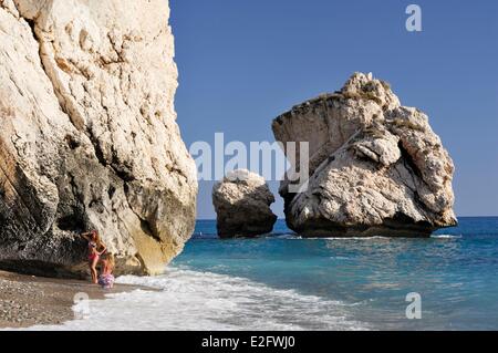 Cyprus Paphos District Petra tou Romiou Aphrodite's Rock young women at the foot of the rock Stock Photo