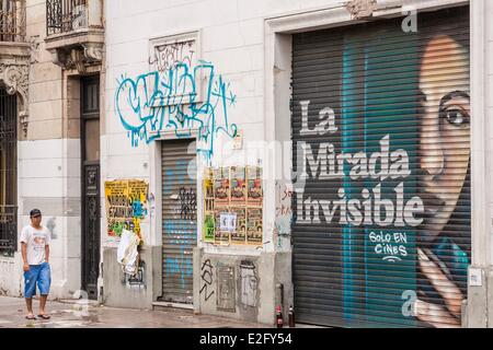 Argentina Buenos Aires Abasto district street scene with painting of the movie poster La Mirada Invisible (The Invisible Eye) Stock Photo