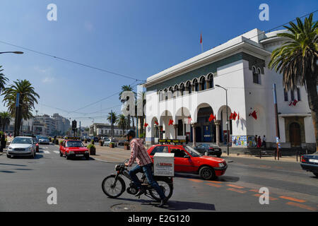 Morocco Casablanca Avenue Hassan II building of the big central post built by the architect Adrien Laforgue in 1918 man on a Stock Photo