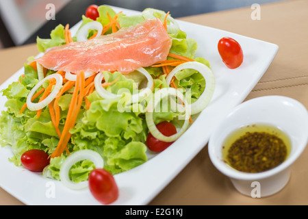 Rare Salmon And Vegetable Salad On White Dish With Sauce Stock Photo 