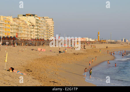 Portugal Grand Porto Povoa de Varzim cacationers on the beach Stock Photo