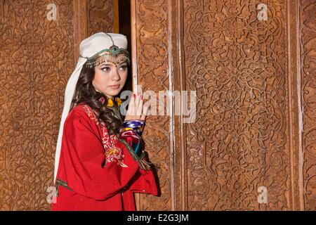 Uzbekistan Silk Road Tashkent applied arts museum old house of diplomat Plovtsev married couple taking pictures in traditional Stock Photo