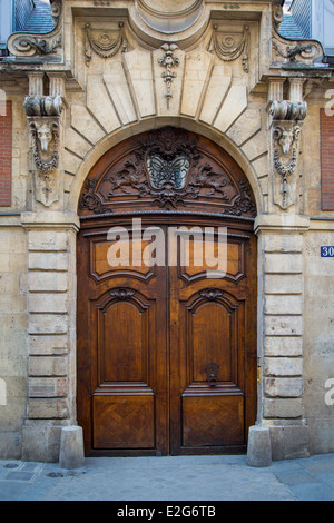 Ornate wooden doors in the Marais district, Paris France Stock Photo