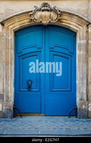 Ornate wooden doors in the Marais district, Paris France Stock Photo