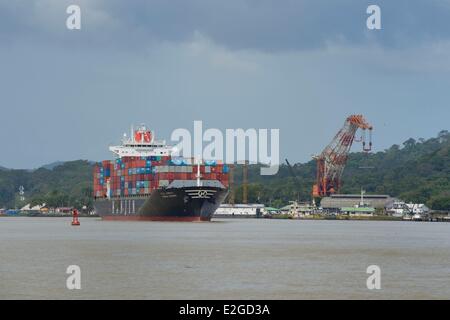 Panama Panama Canal at Gamboa Korean Panamax container cargo Titan crane built by Nazi Germany in background Stock Photo