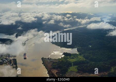 Panama Panama Canal at Gamboa arm of Chagres River which supplies water to canal and Gatun Lake Gaillard cut (or cut Culebra) and skyline of Panama City in background (aerial view) Stock Photo