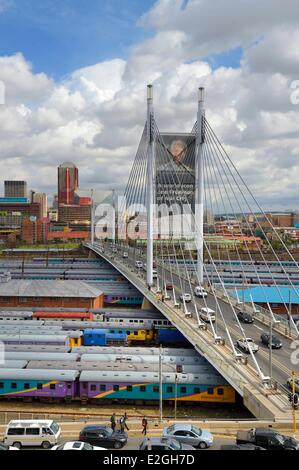 South Africa Gauteng province Johannesburg Nelson Mandela bridge over train carriages at Park Station and Johannesburg CBD (Central Business District) seen district of Braamfontein Stock Photo