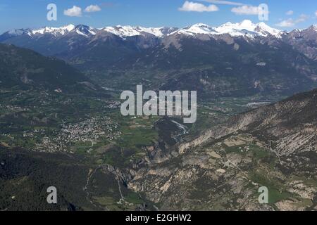 France Hautes Alpes View on Guillestre and Durance valley with snowy summits of mountains of Ecrins (aerial view) Stock Photo