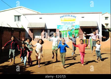 Madagascar Central Highlands Antsirabe school children jumping out of joy Stock Photo