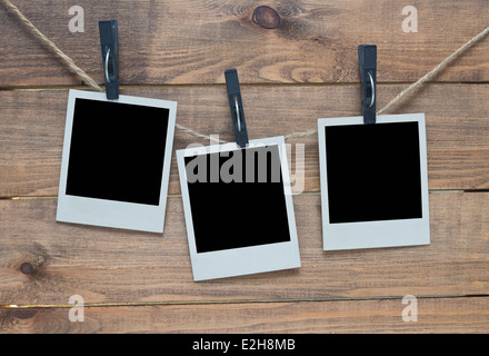 empty polaroid photo frames on wooden background Stock Photo