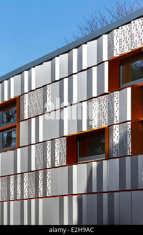 The Livity School, London, United Kingdom. Architect: Haverstock Associates LLP, 2013. View along steel clad facade. Stock Photo
