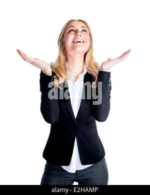 Happy excited business woman with raised hands and looking up waiting for inspiration, isolated on white background, good job Stock Photo