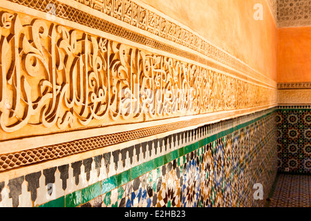 Detail of the fine carving and tile-work at the Ben Youssef Medersa in Marrakesh, Morocco, North Africa. Stock Photo