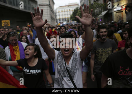 Madrid, Spain. 19th June, 2014. Protestors shout slogans during a demonstration against the Monarchy in Madrid, Spain, Thursday, June 19, 2014. Dozens of protestors gathered in Madrid's main square to protest against the Spanish Monarchy on the day Spain's King Felipe VI was crowned. Credit:  Rodrigo Garcia/NurPhoto/ZUMAPRESS.com/Alamy Live News Stock Photo