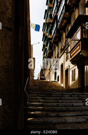Stone steps leading up to Old Theater Street, in Valletta. Stock Photo