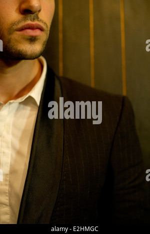 Man in suit, obscured face Stock Photo