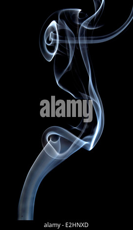 PATTERN OF WHITE SMOKE TURBULENCE ON A BLACK BACKGROUND Stock Photo