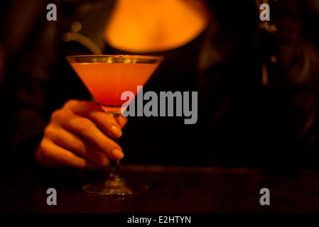 Woman holding cocktail, cropped Stock Photo