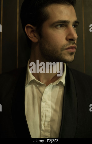 Young man looking away, portrait Stock Photo