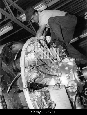 This image depicts engine maintenance being performed on an aircraft at NAS North Island, showcasing the technical expertise and vital support required to keep military aircraft operational during their service. Stock Photo