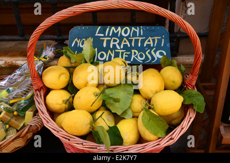 Basket of fresh lemons on sale Monterosso in Italy Stock Photo