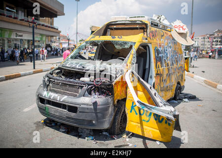 Destroyed NTV broadcast van on Taksin Square during demostration in Istanbul.  Where: Istanbul,  , Turkey When: 04 Jun 2013 Stock Photo