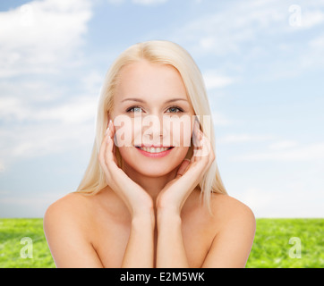 beautiful woman touching her face skin Stock Photo