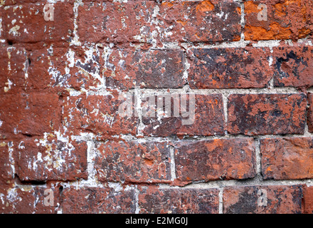 Old red brick wall with cracks Stock Photo