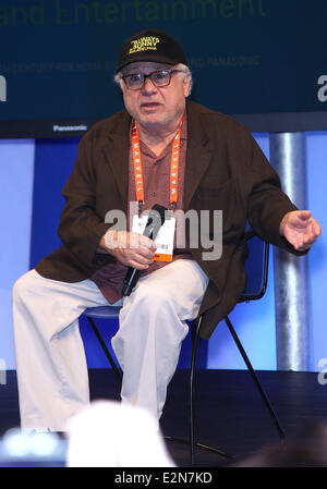 Danny Devito takes of his shoes and socks during an appearance at the Panasonic Booth at the 2013 Consumer Electronics Show  Featuring: Danny Devito Where: Las Vegas, Nevada, United States When: 09 Jan 2013 Stock Photo