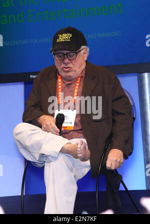 Danny Devito takes of his shoes and socks during an appearance at the Panasonic Booth at the 2013 Consumer Electronics Show  Featuring: Danny Devito Where: Las Vegas, Nevada, United States When: 09 Jan 2013 Stock Photo