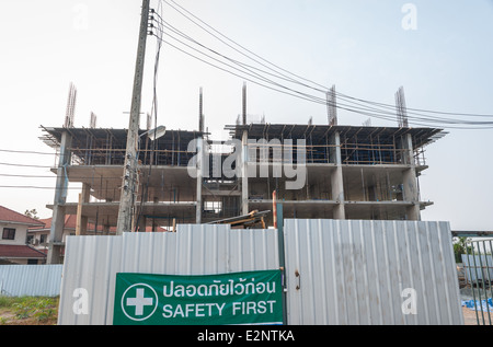 Closed Construction Site with Safety First Sign in Thai. Stock Photo