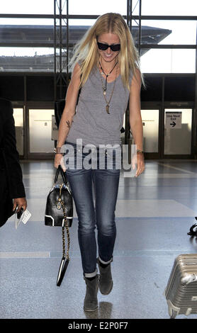 A cheerful looking Gwyneth Paltrow arrives at LAX airport sporting what resembles a temporary tattoo of an eagle on her right forearm  Featuring: Gwyneth Paltrow Where: Los Angeles, California, United States When: 19 Jan 2013 Stock Photo