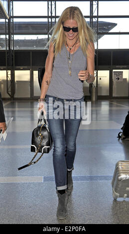 A cheerful looking Gwyneth Paltrow arrives at LAX airport sporting what resembles a temporary tattoo of an eagle on her right forearm  Featuring: Gwyneth Paltrow Where: Los Angeles, California, United States When: 19 Jan 2013 Stock Photo