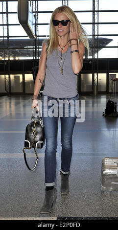 A cheerful looking Gwyneth Paltrow arrives at LAX airport sporting what resembles a temporary tattoo of an eagle on her right forearm  Featuring: Gwyneth Paltrow Where: Los Angeles, California, United States When: 19 Jan 2013 Stock Photo