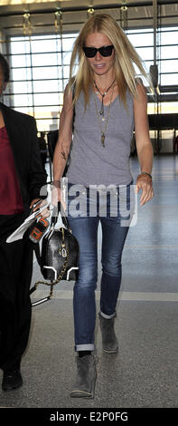 A cheerful looking Gwyneth Paltrow arrives at LAX airport sporting what resembles a temporary tattoo of an eagle on her right forearm  Featuring: Gwyneth Paltrow Where: Los Angeles, California, United States When: 19 Jan 2013 Stock Photo