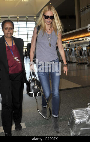 A cheerful looking Gwyneth Paltrow arrives at LAX airport sporting what resembles a temporary tattoo of an eagle on her right forearm  Featuring: Gwyneth Paltrow Where: Los Angeles, California, United States When: 19 Jan 2013 Stock Photo