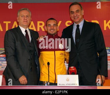 Dutch Footballler Wesley Sneijder attends a press conference after a health check in Istanbul. Sneijder has signed 3.5 years contract with Galatasaray Football club.  Featuring: Ali Durust,Wesley Sneijder,Lutfu Aribogan Where: Istanbul, Turkey When: 22 Jan 2013  **** Stock Photo